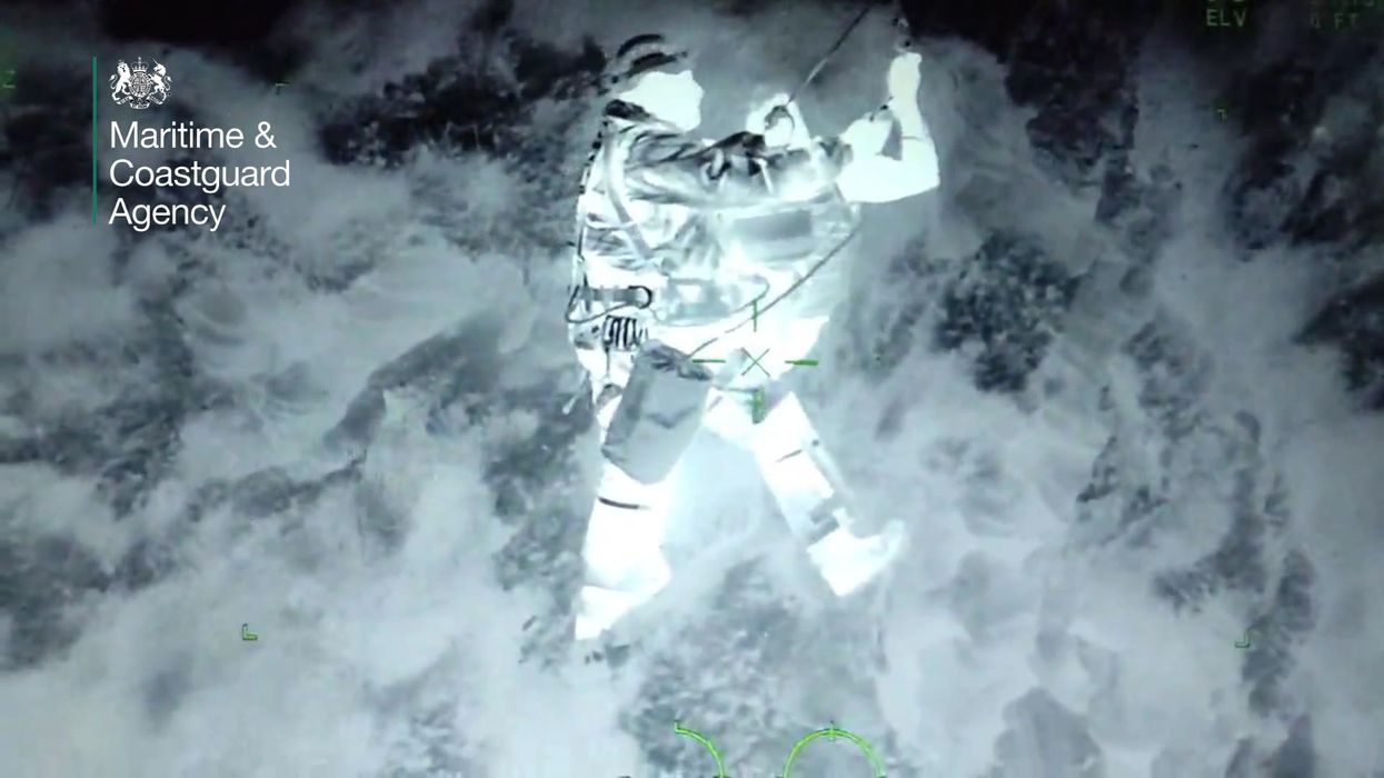 Shocking footage shows walker being rescued from edge of a cliff