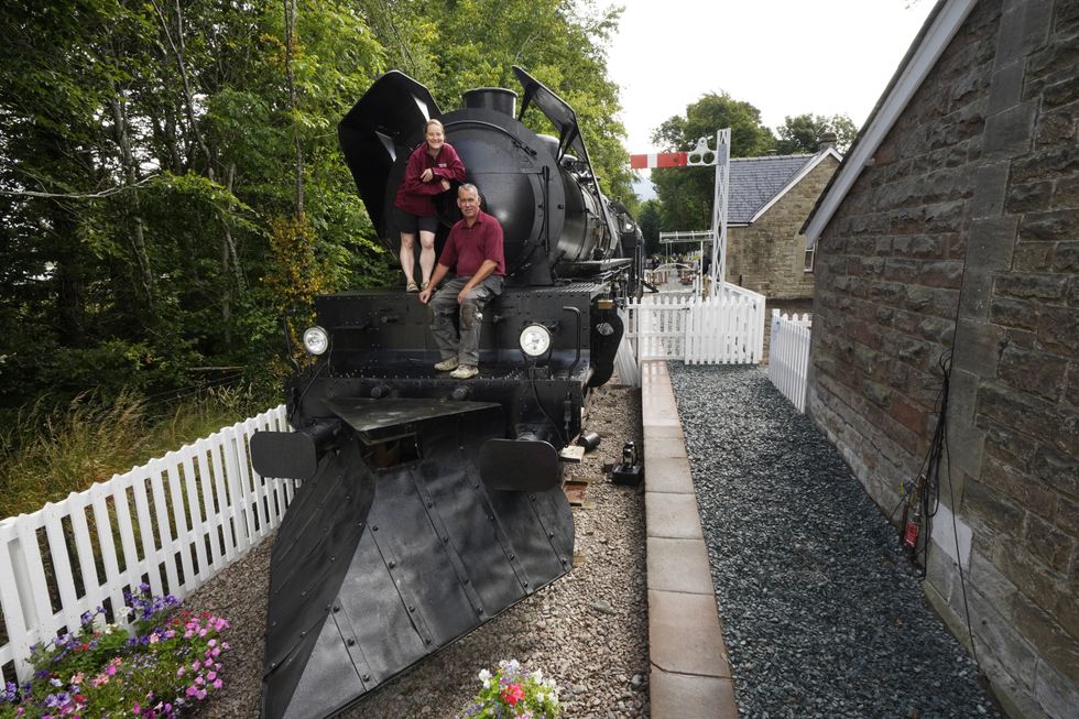 Simon and Diana Parums with their steam train (Owen Humphreys/PA)