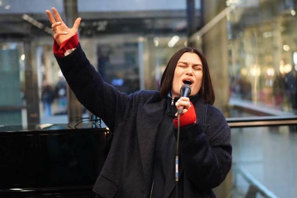 Singer Jessie J surprises travellers with a performance at St Pancras train station in central London