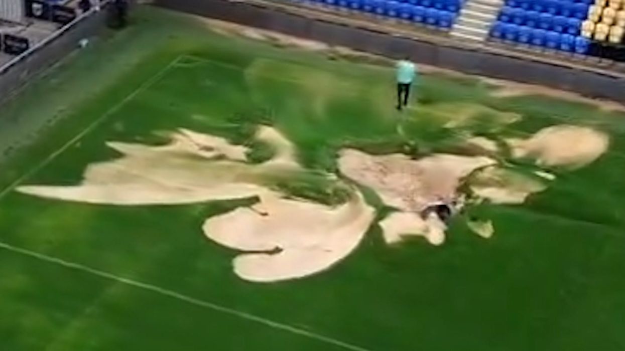 Massive 'sinkhole' opens up on AFC Wimbledon pitch after 'extensive flooding'