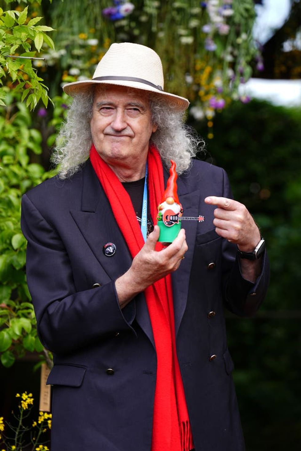 Sir Brian May holding the gnome he painted to raise money for the RHS Campaign for School Gardening, at the RHS and The King\u2019s Foundation Curious Garden exhibit, during press day at the RHS Chelsea Flower Show, at the Royal Hospital Chelsea in London