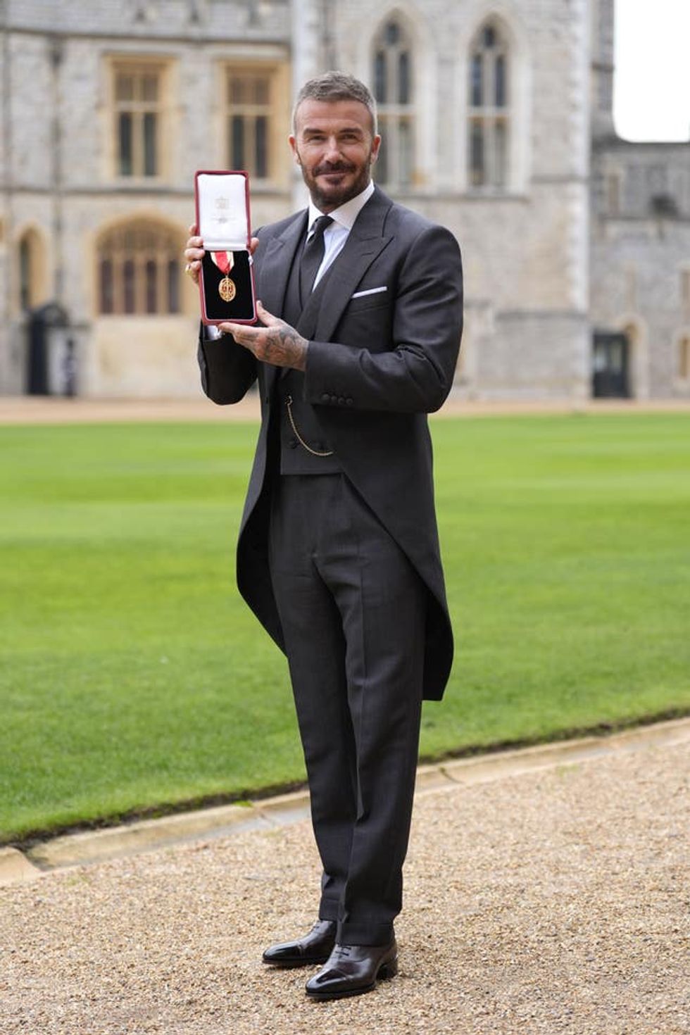 Sir David Beckham after he was made a Knight Bachelor at an investiture ceremony at Windsor Castle, Berkshire