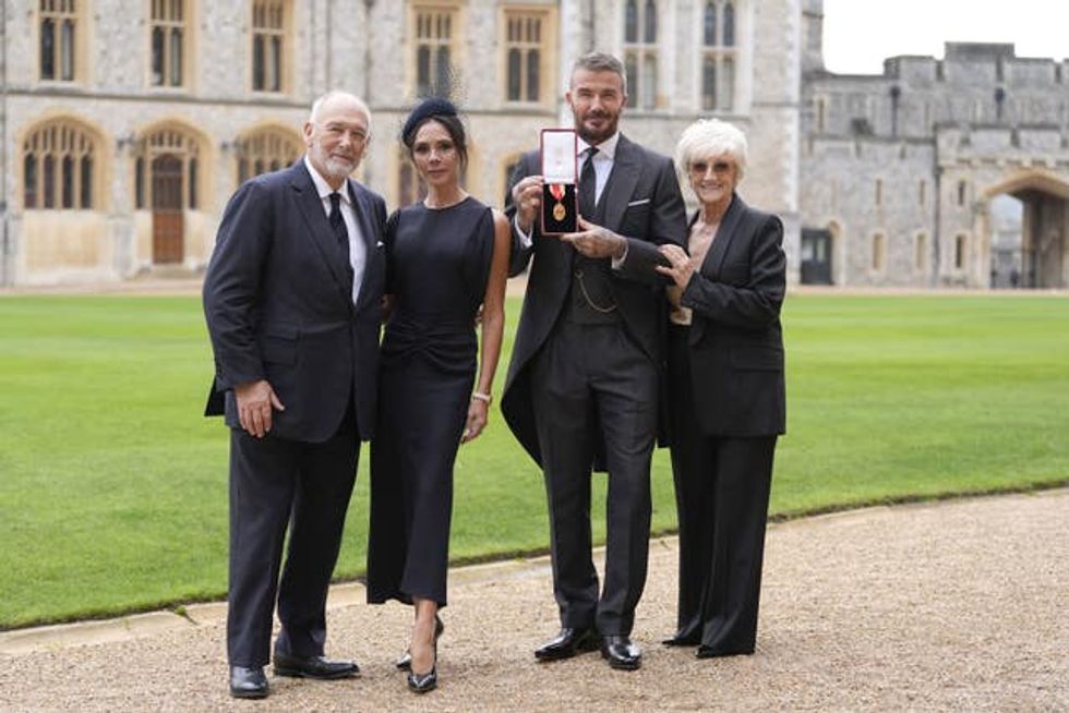 Sir David Beckham, with his wife Lady Victoria and parents Ted and Sandra Beckham, after he was made a Knight Bachelor at an investiture ceremony at Windsor Castle, Berkshire
