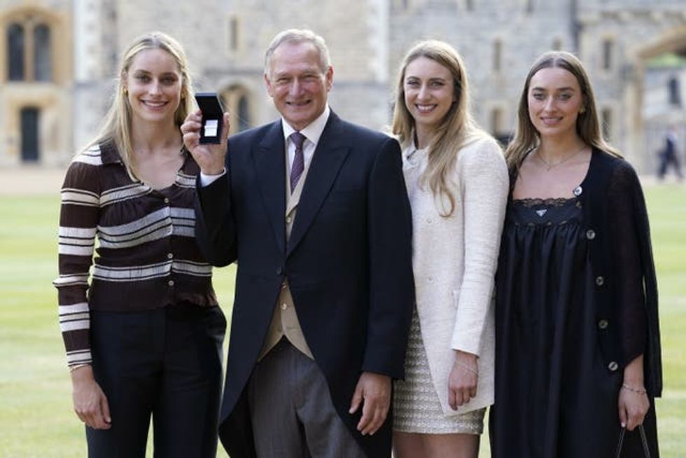 Sir David Hempleman-Adams with daughters (left to right) Alicia, Camilla and Amelia, after being awarded a Bar to the Polar Medal at Windsor Castle in 2023 (Andrew Matthews/PA)