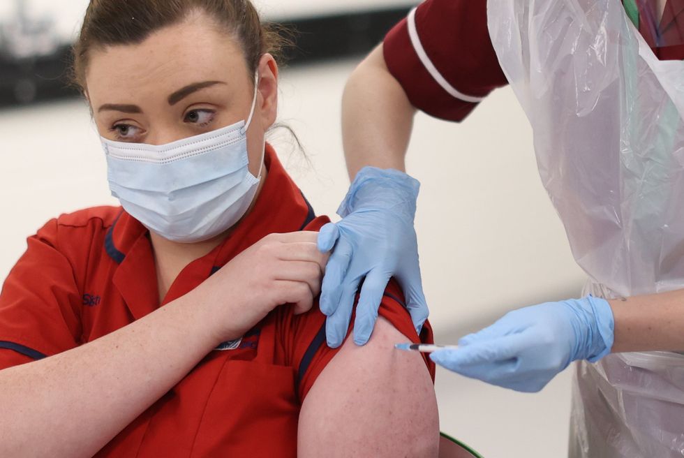 Sister Joanna Sloan becomes the first person in Northern Ireland to have the vaccine.