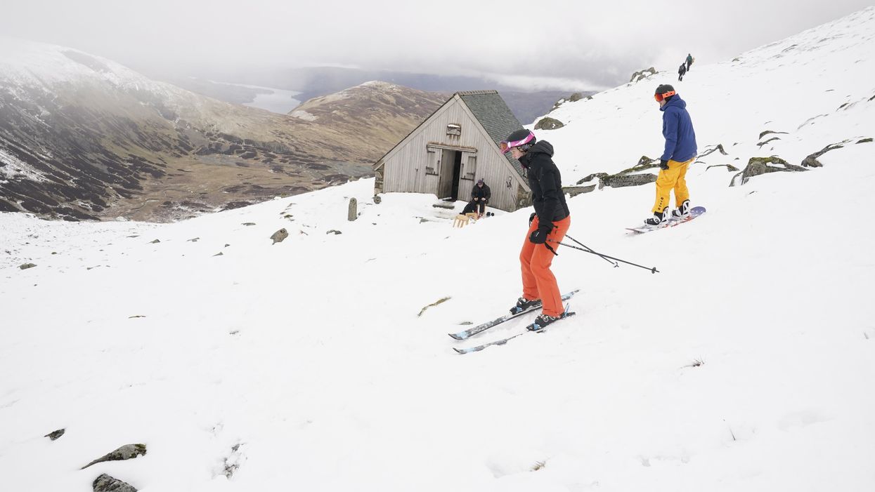 Skiers and snowboarders on Raise, near Helvellyn