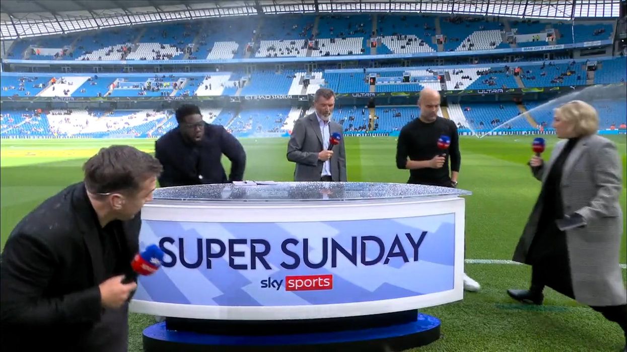 Gary Neville soaked by sprinklers in build-up to the Manchester Derby