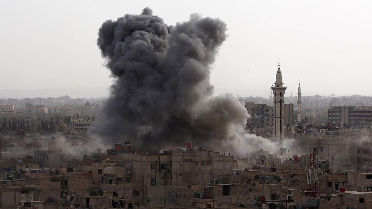 Smoke billows from the Syrian rebel-held area of Douma, east of the capital Damascus on 16 September 2015