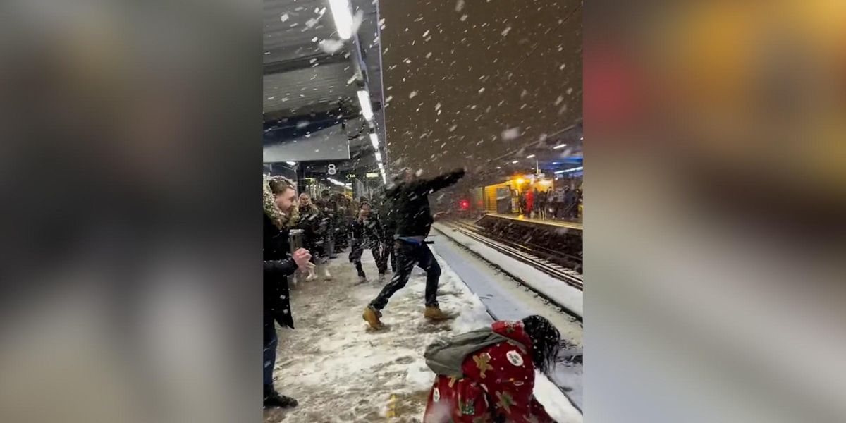 Snowfall Fight Moment huge snowball fight breaks out at east London train station ...