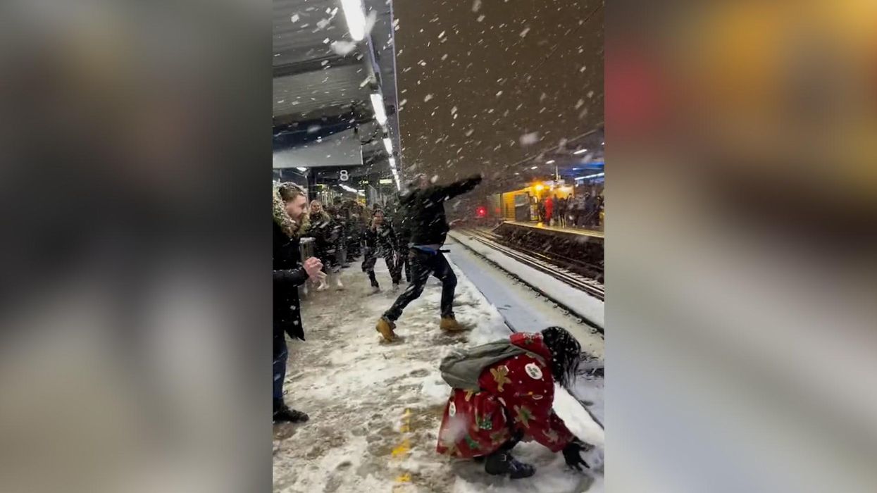 Moment huge snowball fight breaks out at east London train station