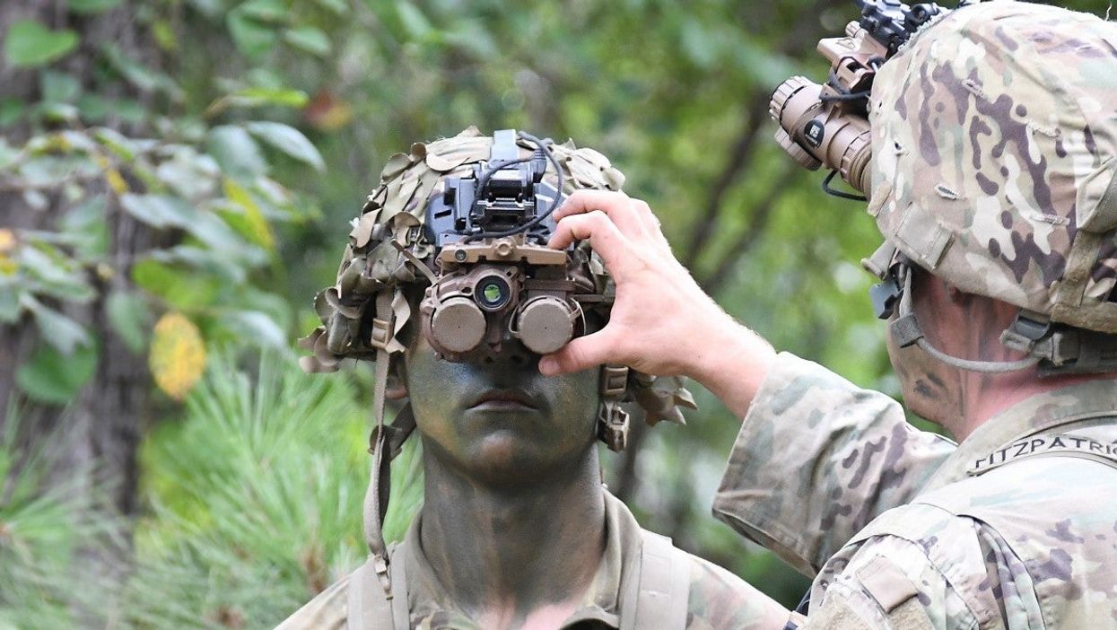 Soldier demonstrating Enhanced Night Vision Goggles-Binocular (ENVG-B.)