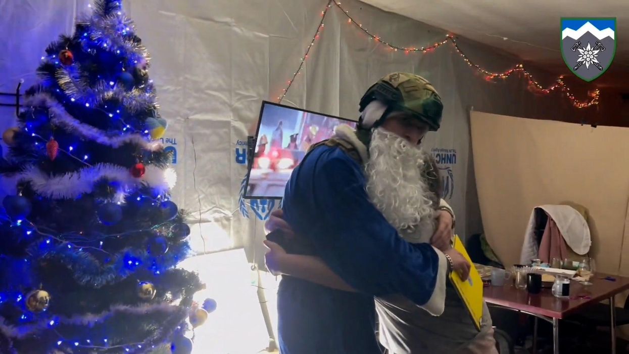 Sweet moment Ukrainian soldiers deliver Christmas gifts to kids on the frontline