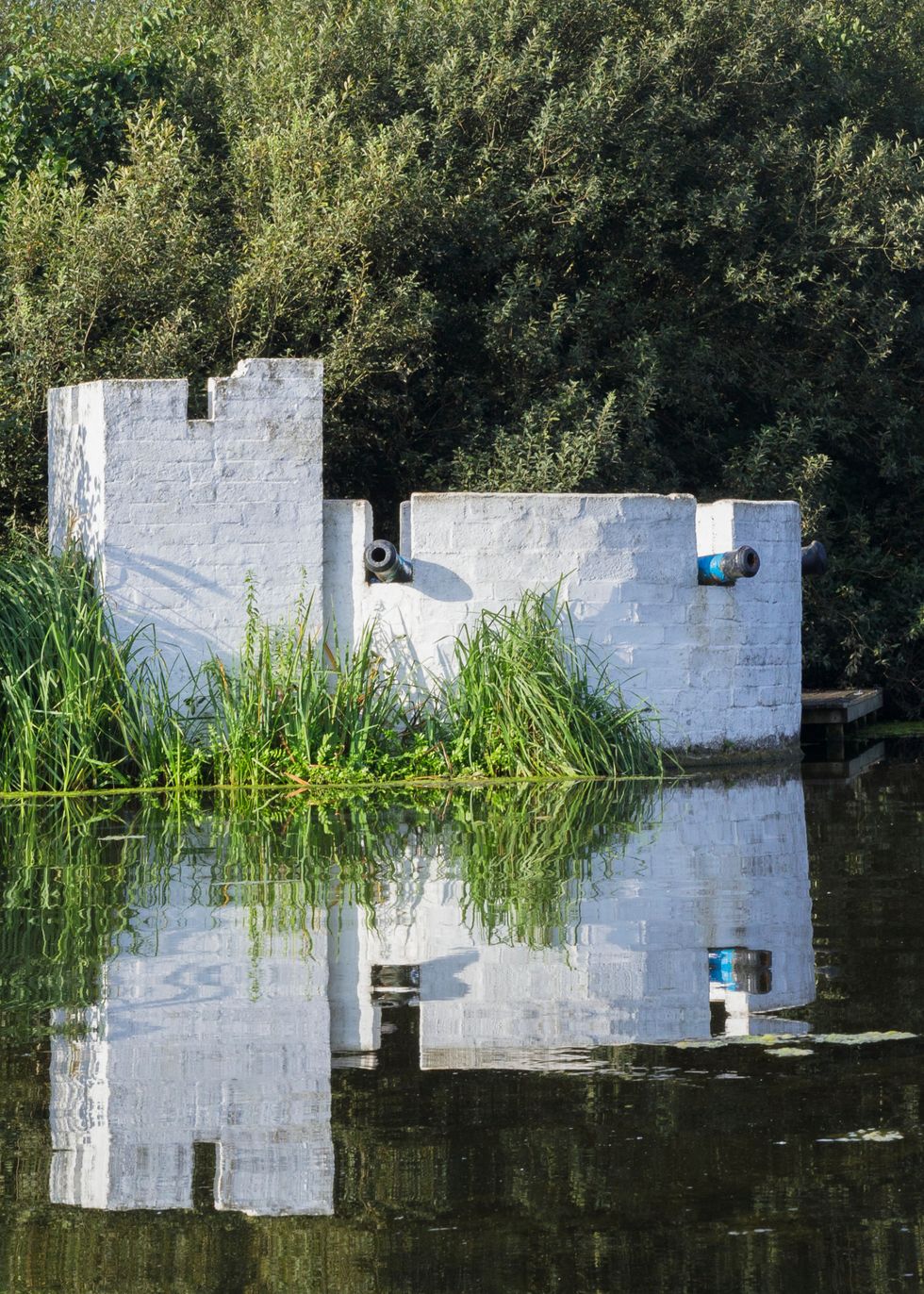Some of the artificial islands at Thorpeness Meare have small buildings on them, like The Fort. (Historic England Archive/ PA)
