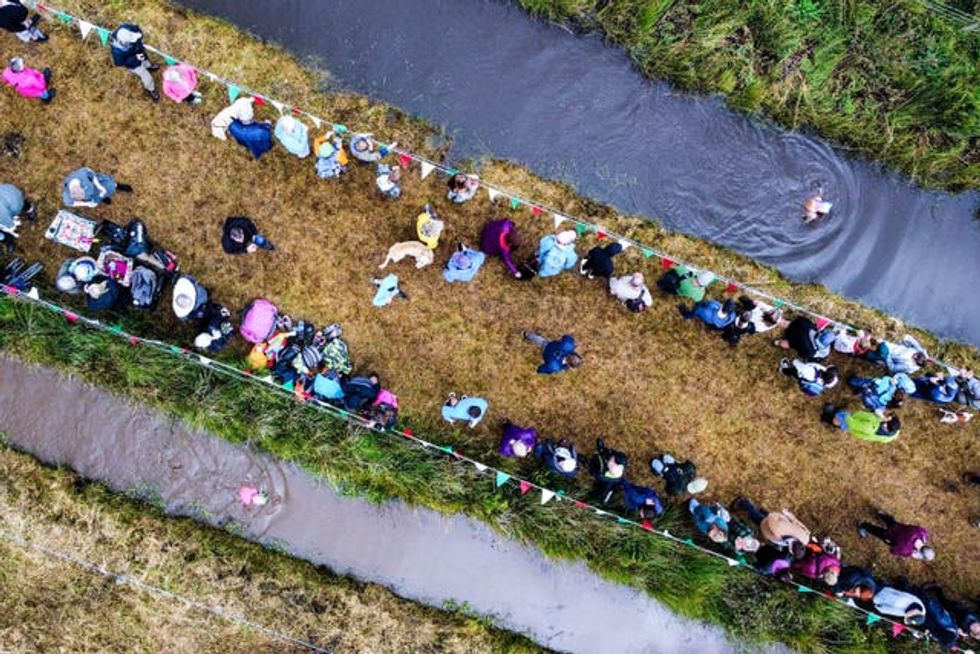 Spectators lined the banks of the bog
