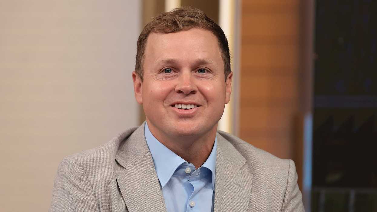 Spencer Pratt, a white man with short brown hair and a grey suit, smiling.