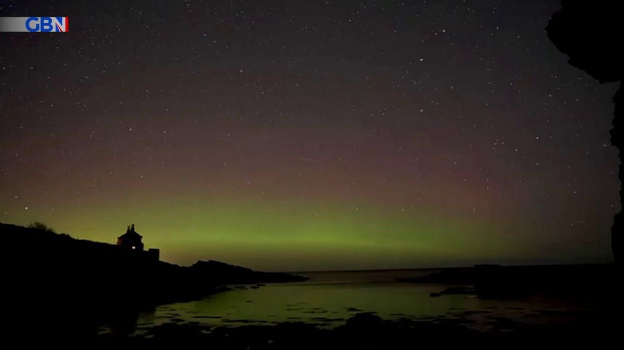 Disappointed friends think they've spotted the northern lights but it's just a hotel