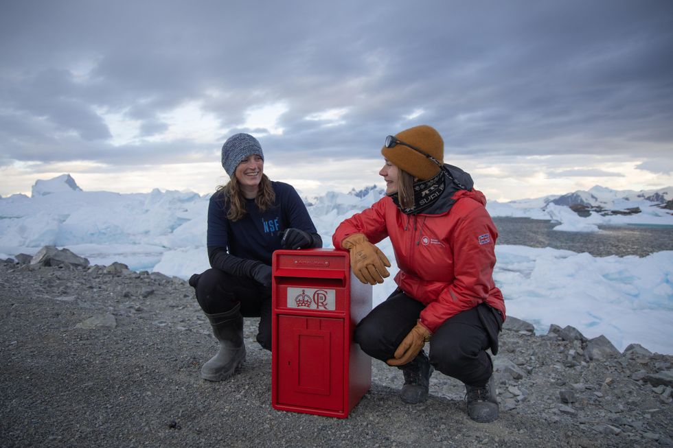 Station support assistant Kirsten Shaw, who wrote to the King, and station leader Aurelia Reichardt with the post box
