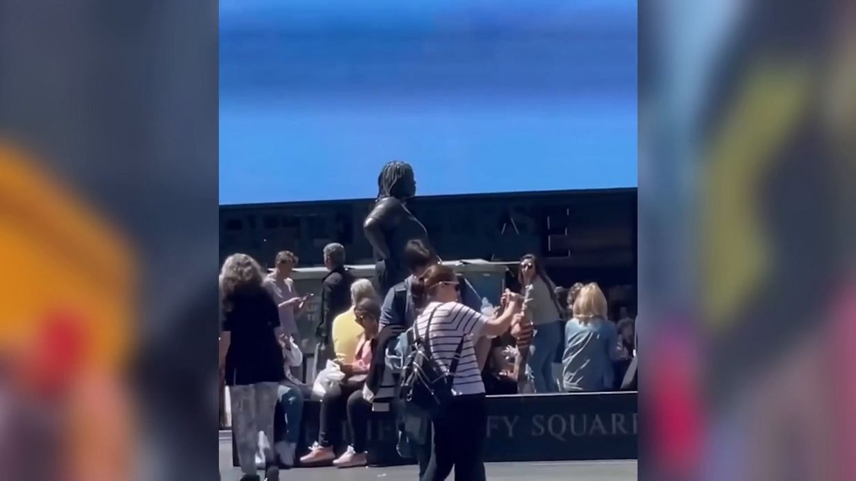 Huge bronze statue of a woman turns heads in Times Square