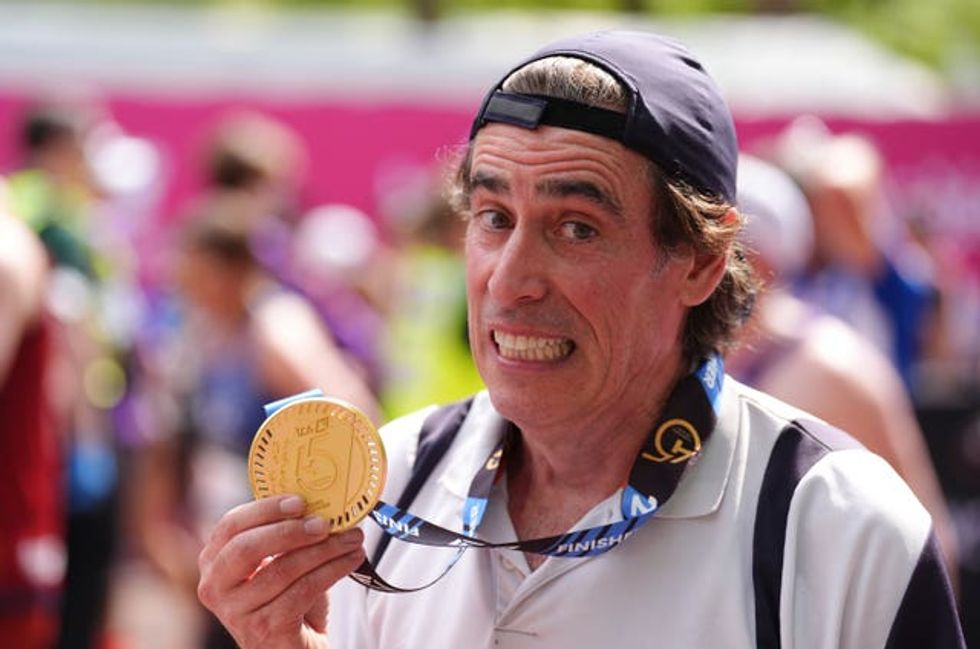 Stephen Mangan after crossing the finish line during the TCS London Marathon.