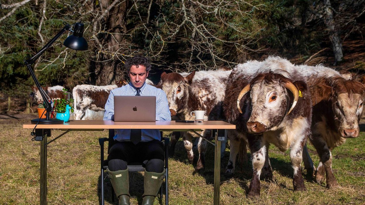Stephen Nasrat at desk in field