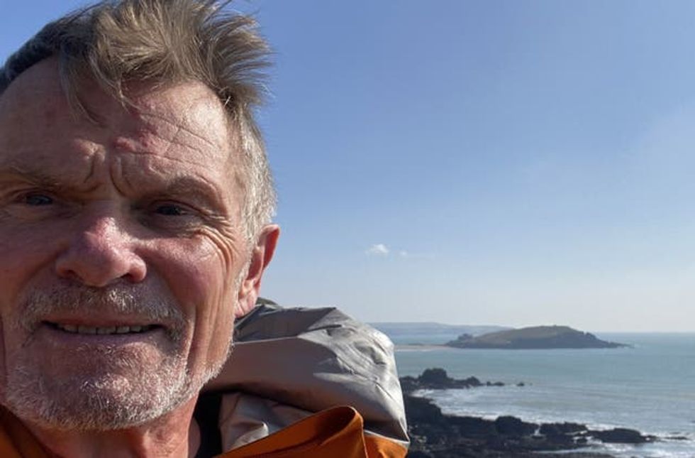 Steve James close-up with coast in background