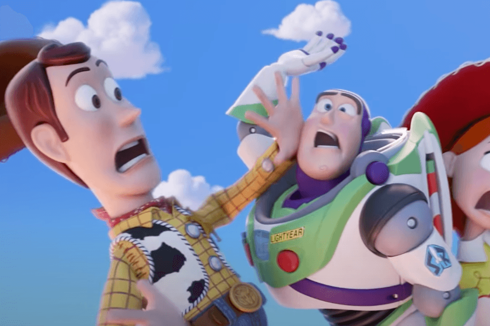 Still from an animated trailer for Toy Story, showing the cowboy Woody crashing into Buzz, a space ranger with a green and purple suit.