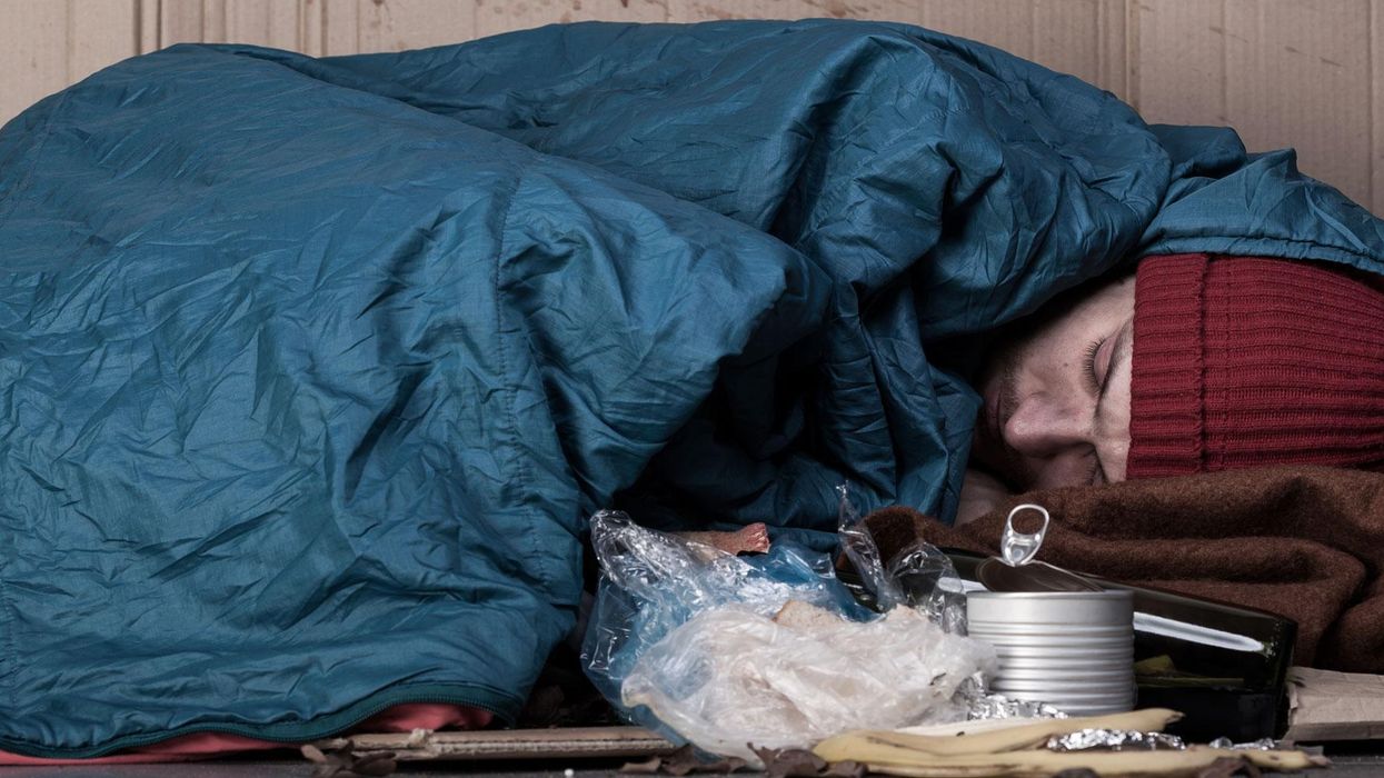 Stock image of a man sleeping rough