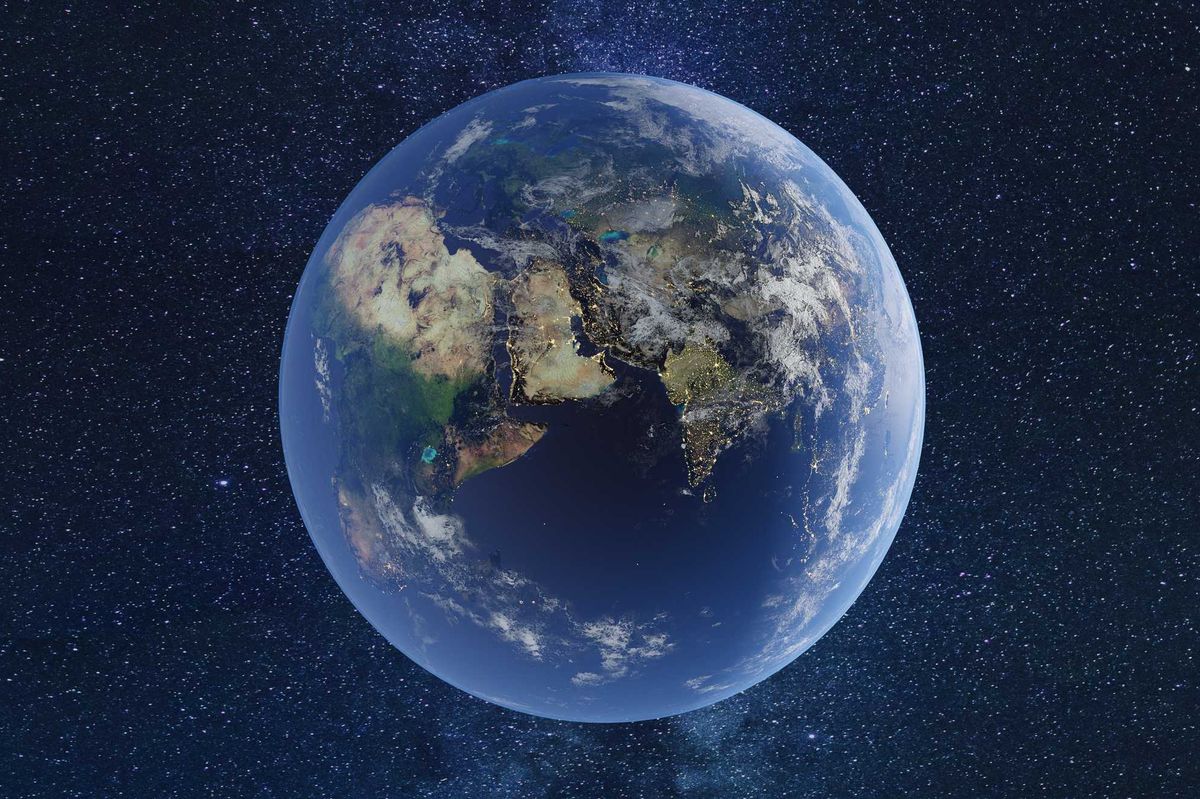 Stock image of Earth in space, surrounded by stars against a blue space.