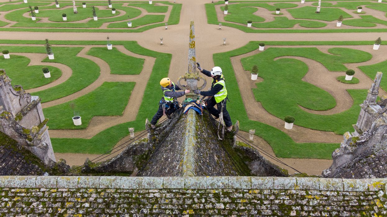 Stonemasons James Preston and John Fowler from SSH Conservation survey Kirby Hall in Corby, Northamptonshire