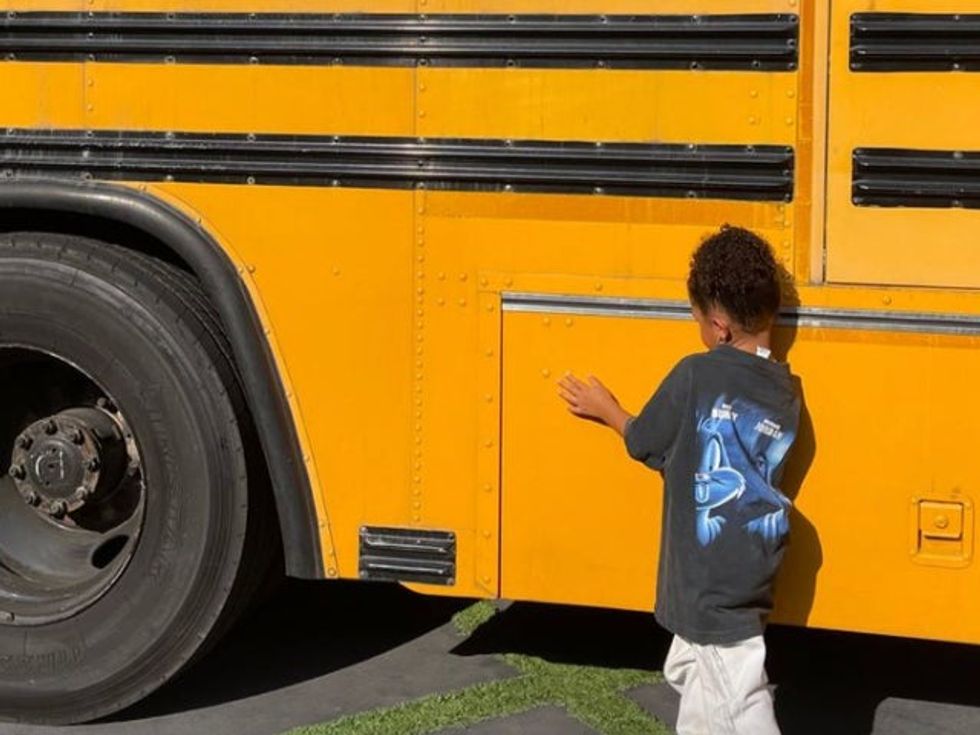 Stormi Webster and school bus