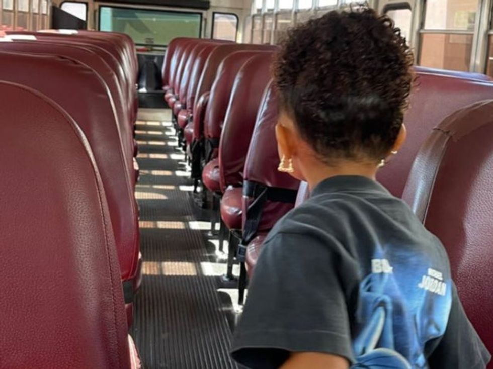 Stormi Webster inside the school bus