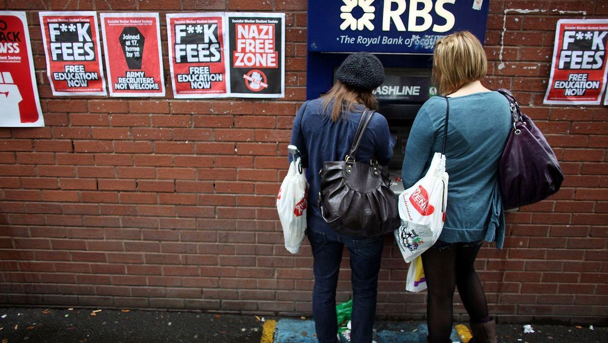 Students arriving for Manchester University's freshers week queue up at a cash machine