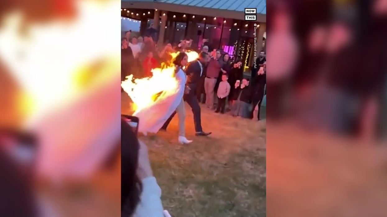 Couple spark debate for 'scandalous' wedding cake topper