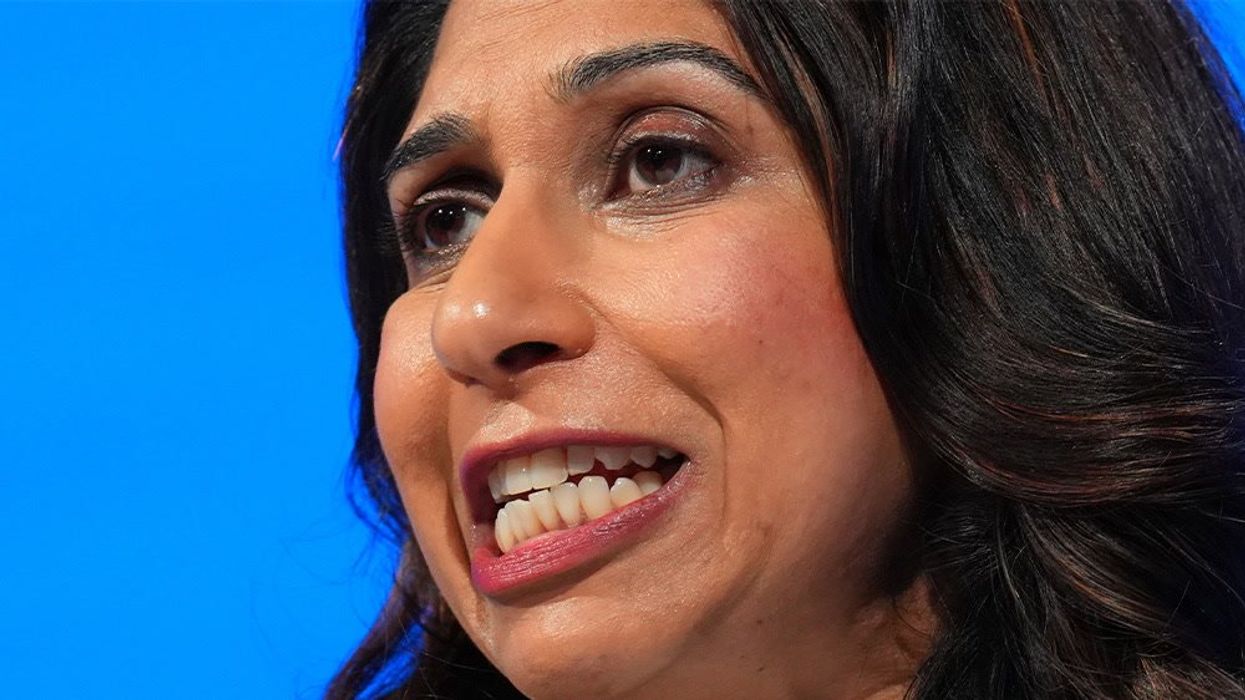 Suella Braverman reacts to photo of herself standing on a guide dog