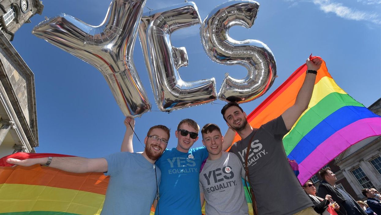 Supporters in favour of same-sex marriage pose for a photograph as thousands gather in Dublin Castle square awaiting the referendum vote outcome on 23 May 2015 in Dublin, Ireland