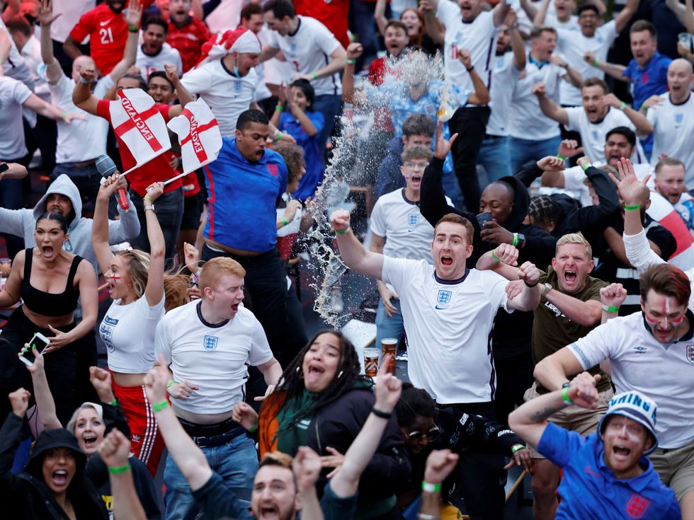 Supporters react to England\u2019s first goal of the night