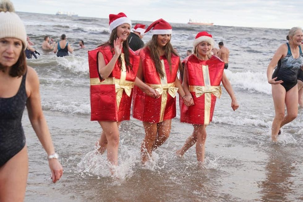 Swimmers take part in the annual Boxing Day Dip at Tynemouth Beach
