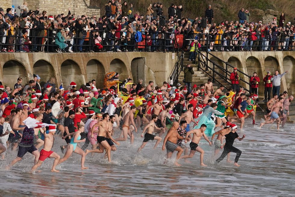 Swimmers don festive outfits for Boxing Day dips for good causes