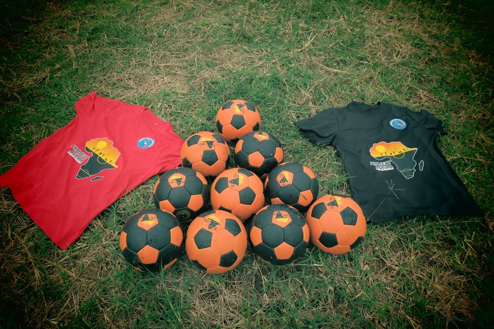 T-shirts and footballs with the logo for Project Africa
