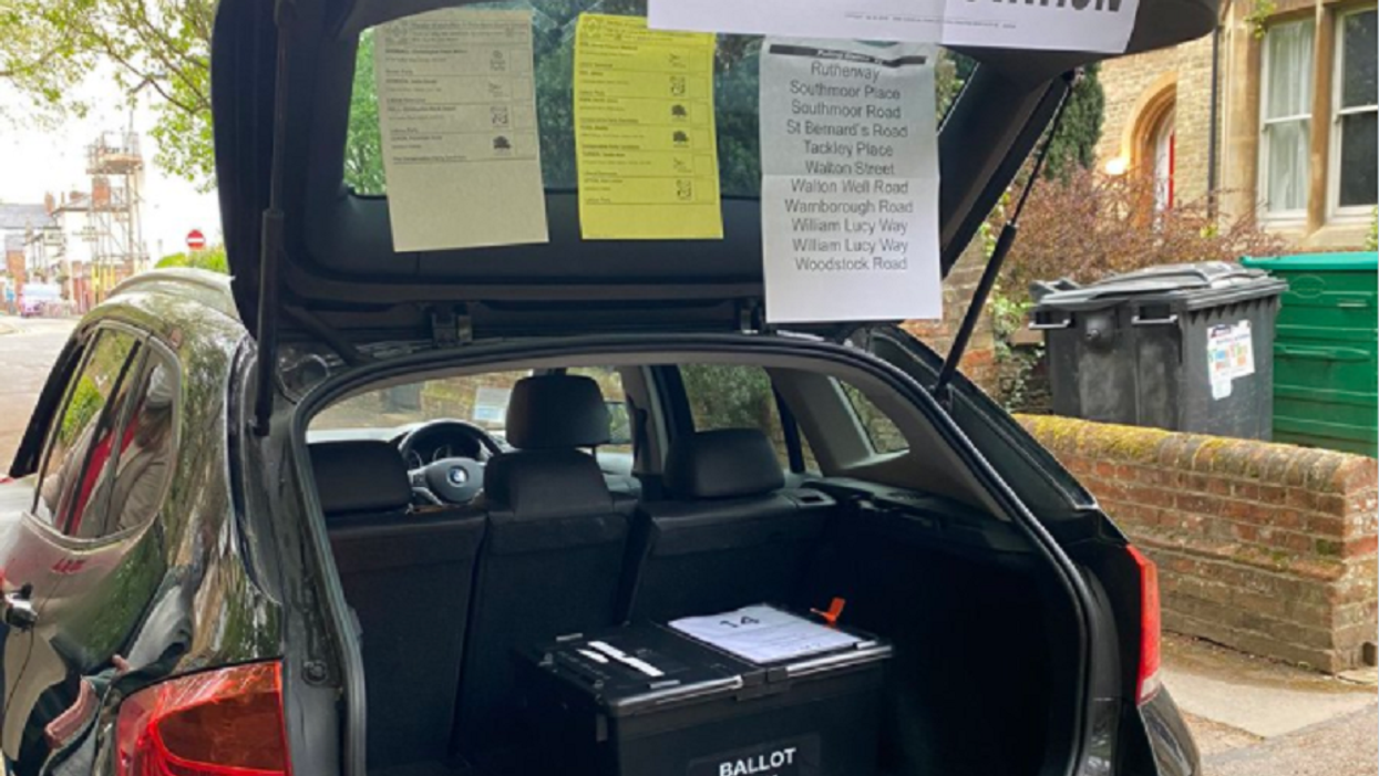 Temporary polling station in a car boot