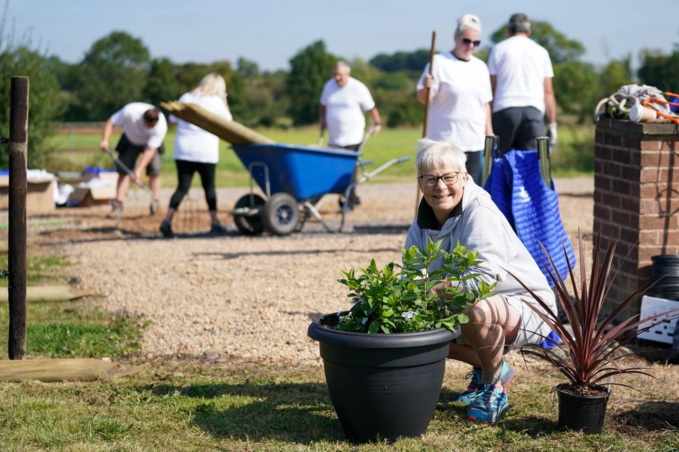 Terri Picton-Clark and other lottery winners help transform the yard at The Way of The Horse, in Lutterworth, Leicestershire (Jacob King/PA)