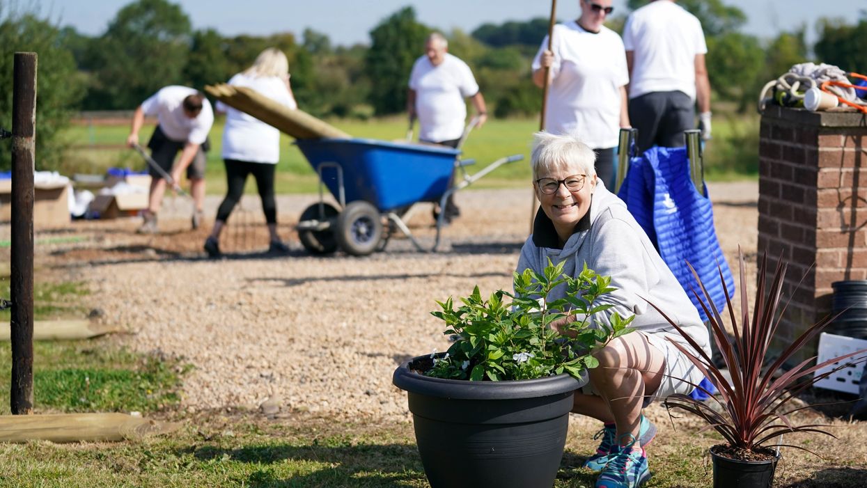 Terri Picton-Clark and other lottery winners help transform the yard at The Way of The Horse, in Lutterworth, Leicestershire (Jacob King/PA)