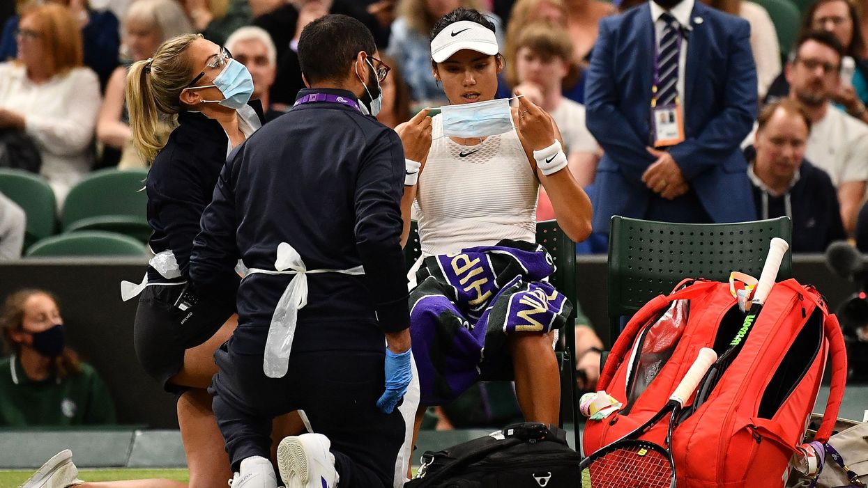 <p>The 18-year-old receives medical care during match against Ajla Tomljanovic</p>