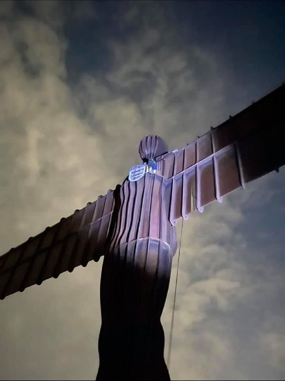 The Angel of the North with an England badge