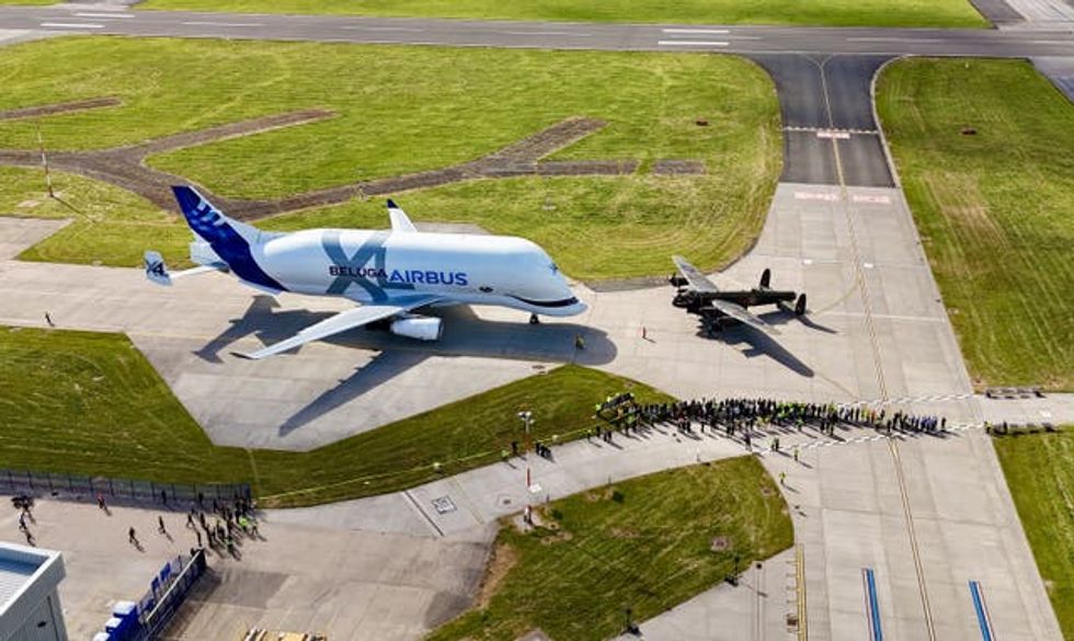 The Avro Lancaster bomber (right) alongside an Airbus BelugaXL