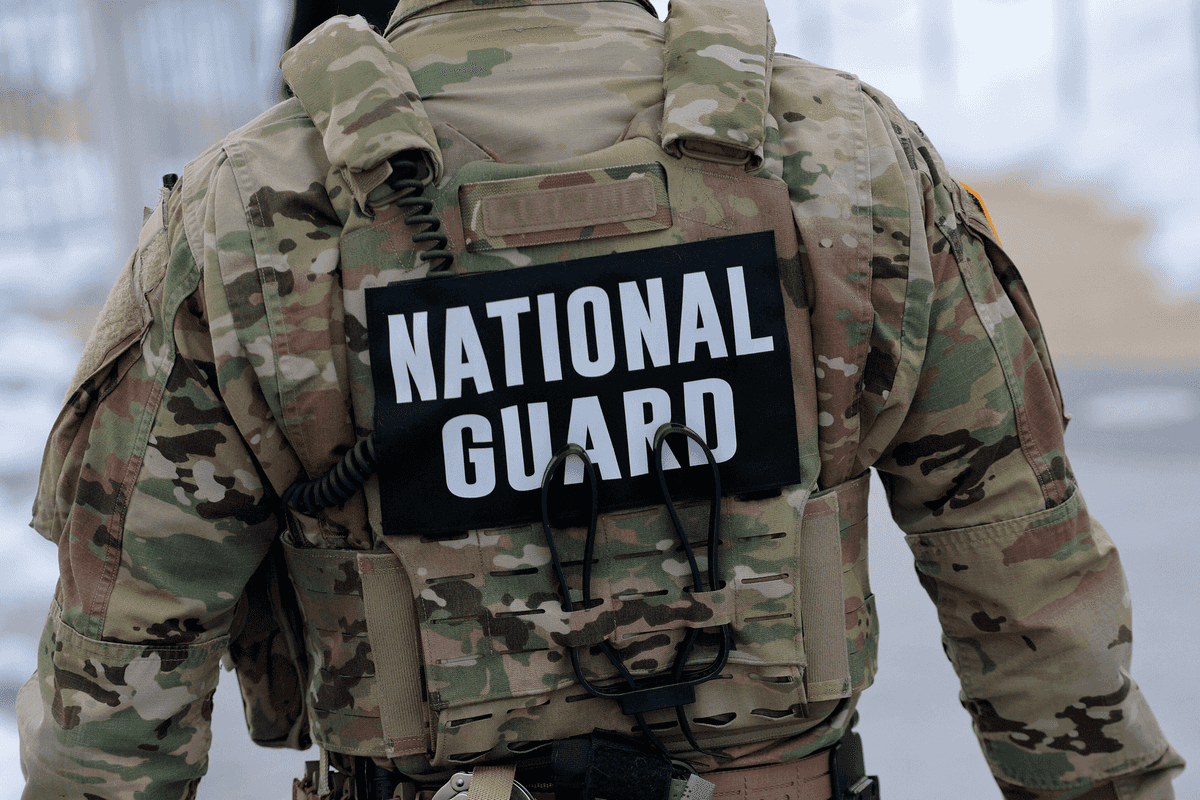 The back of a man in National Guard uniform.