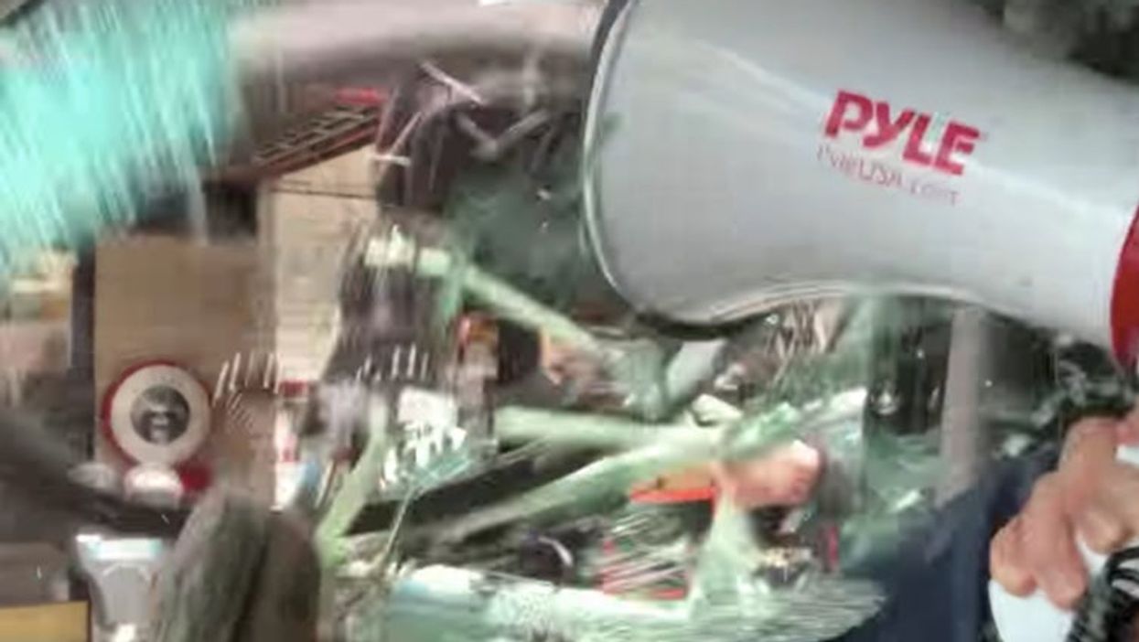 <p>The car window is shattered by the bike </p>