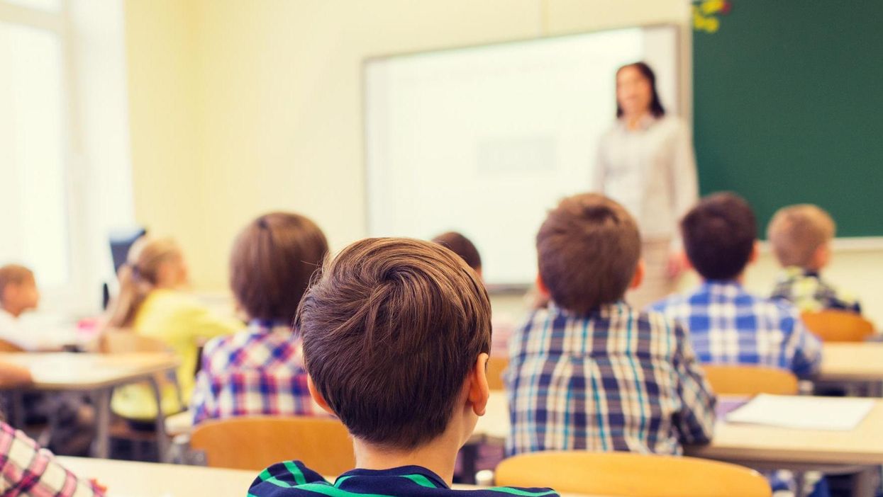 The children were allegedly told by teachers they could no longer socialise with their classmate