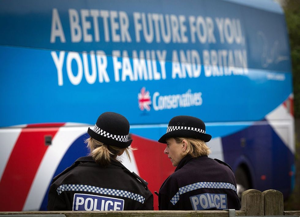 The Conservative party 'battle' bus arrives at the village hall in Norton Sub Hamdon in the Yeovil constituency on April 26, 2015. Avon & Somerset Constabulary are among the 12 police forces investigating the Conservatives.