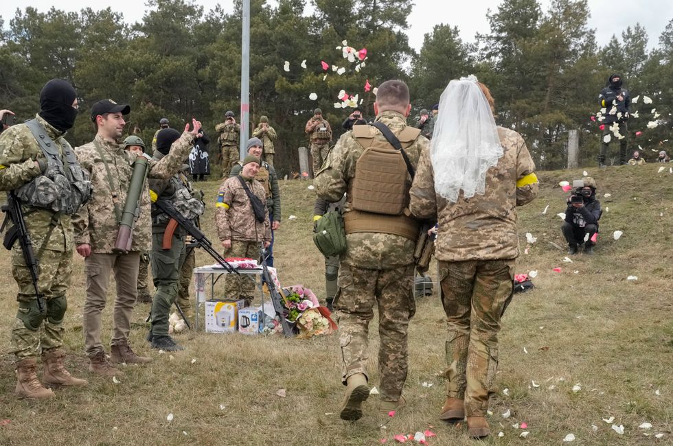 Ukrainian volunteer troops marry in military fatigues at Kyiv checkpoint